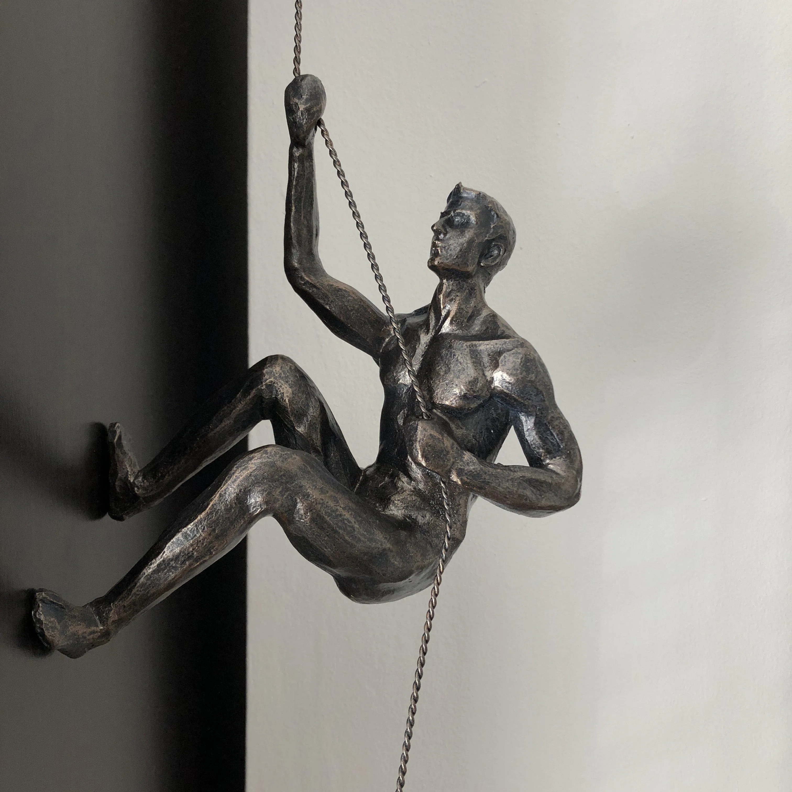 Bronze Climbing Man